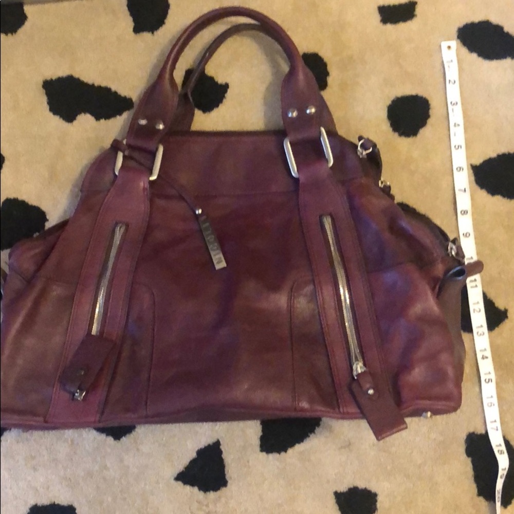 Beautiful plum colored Italian leather hand bag